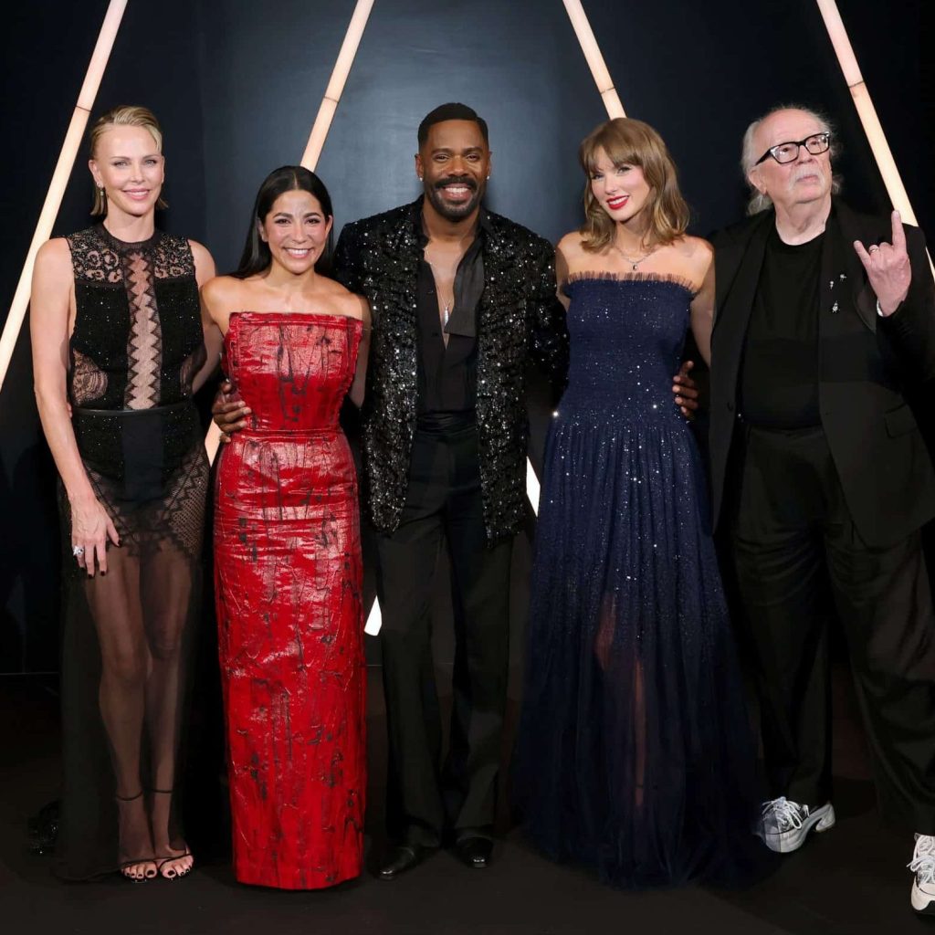 Charlize Theron, Colman Domingo, Taylor Swift and John Carpenter posing together at the Academy Museum Gala