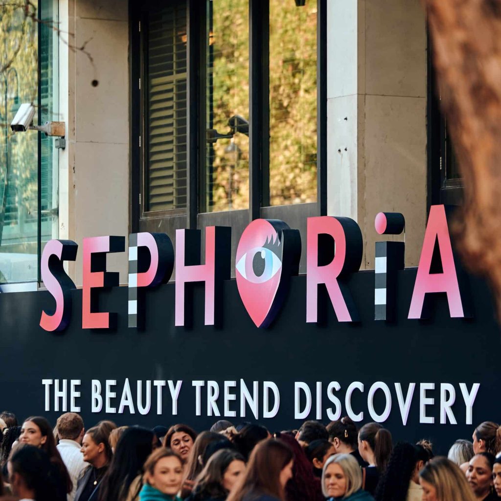 Crowd gathered outside a building beneath a large "Sephoria: The Beauty Trend Discovery" sign with an eye logo.
